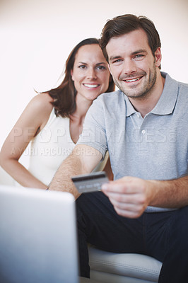 Buy stock photo Portrait of a young couple doing their banking online