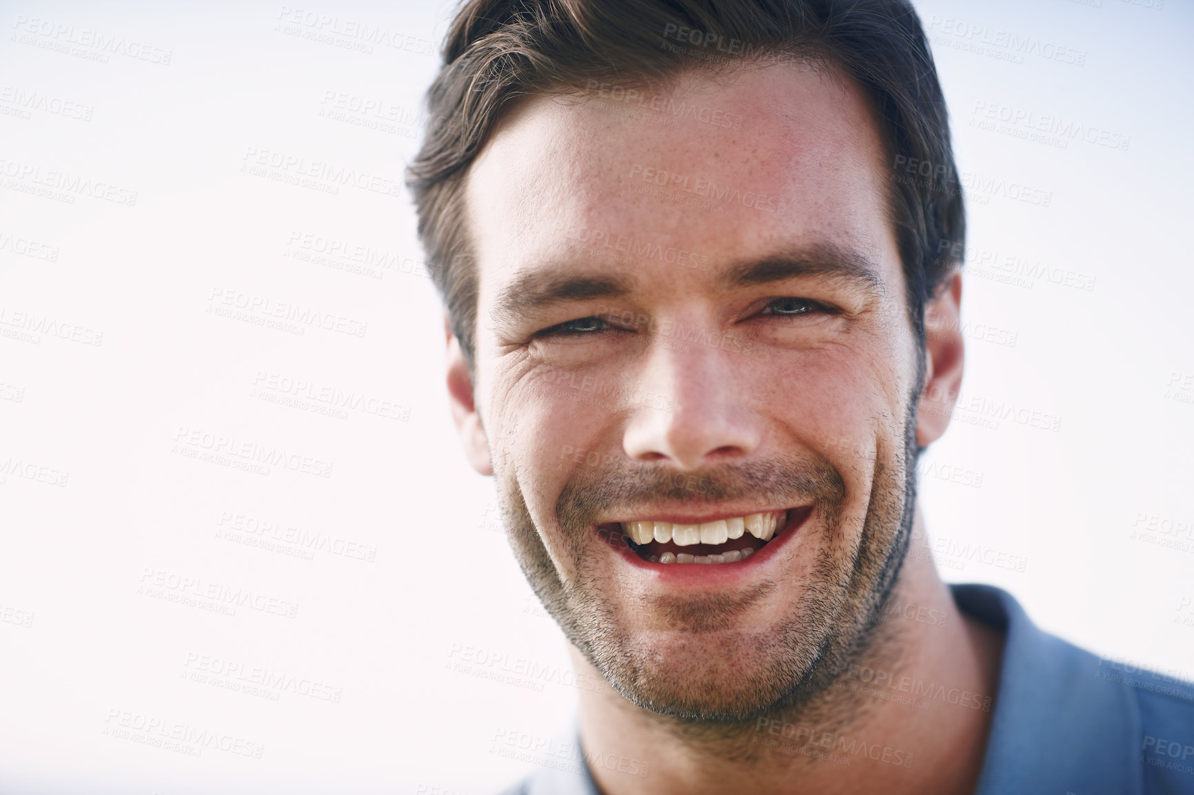 Buy stock photo Headshot of a handsome young man smiling cheerfully