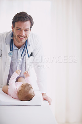 Buy stock photo Portrait of a male doctor standing by his tiny patient