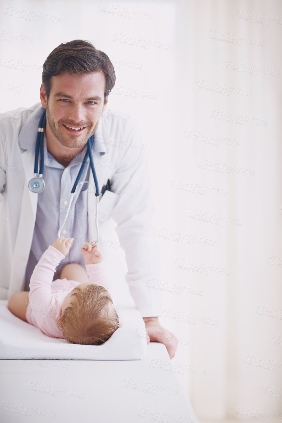 Buy stock photo Medical, portrait and smile of doctor with baby in hospital for checkup or development. Appointment, healthcare and stethoscope with happy pediatrician man and infant child for assessment with space