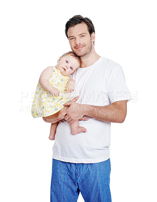 Buy stock photo A proud young dad standing with his lovely baby daughter in his arms
