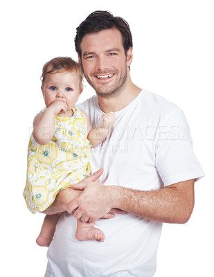 Buy stock photo A young man standing with his cute baby daughter in his arms
