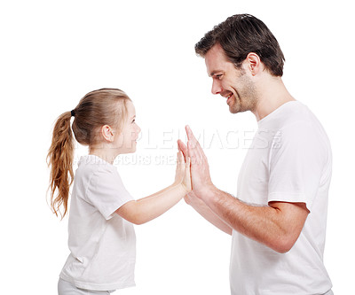 Buy stock photo Side view of a young father having fun with his young daughter