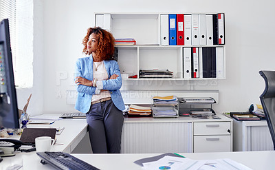 Buy stock photo Shot of a young businesswoman standing in her office
