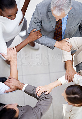Buy stock photo Business people, top view and arm circle in office in support for teamwork, collaboration or partnership. Corporate, solidarity or team with elbow link for mission unity, trust or workflow efficiency