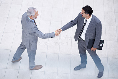 Buy stock photo Above of business people, CEO or shaking hands for recruitment, collaboration or teamwork. Handshake, partnership or employee in corporate agreement with meeting success, welcome or office thank you
