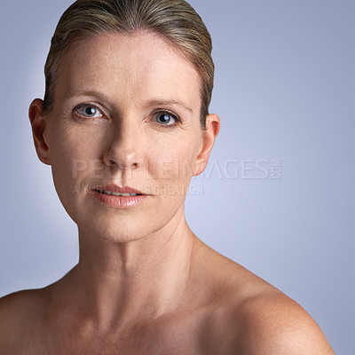 Buy stock photo Face, skincare and portrait of mature woman doing cosmetic skin care facial isolated in a grey studio background. Cosmetics, wellness and old female model calm with natural beauty due to anti aging