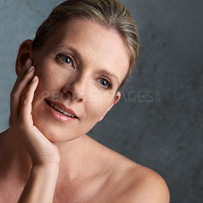 Buy stock photo Mature woman, skincare closeup and face with natural beauty and cosmetic dermatology. Isolated, gray background and female person with facial treatment and self care with anti aging cosmetics