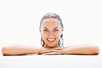 Smiling female at the edge of a swimming pool