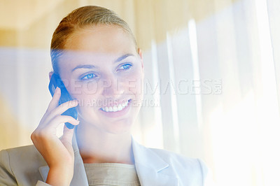 Buy stock photo Cute young business woman speaking over the cellphone , view through a glass