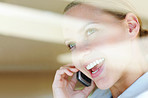 Closeup of a happy female speaking on the cellphone