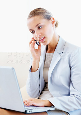 Buy stock photo Pretty business woman using a cellphone and laptop together