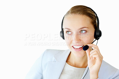 Buy stock photo Young female secretary having a conversation over headset against white