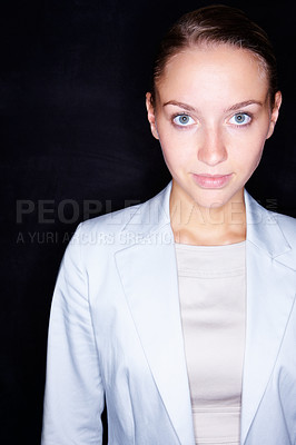 Buy stock photo Portrait of an elegant young business woman against black background
