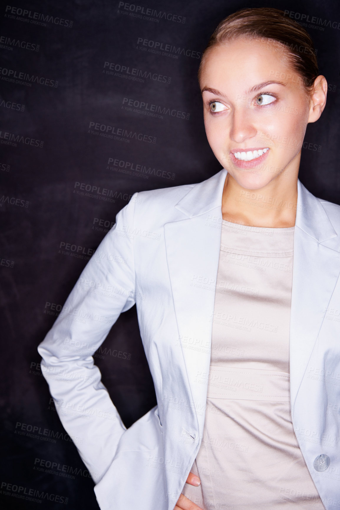 Buy stock photo Beautiful smiling business woman looking away against a black background