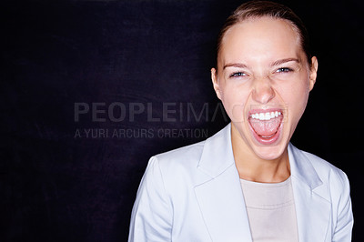 Buy stock photo Young business woman screaming in anger , isolated against black background