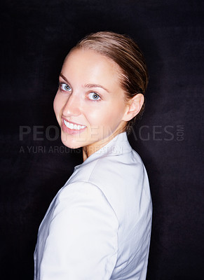 Buy stock photo Pretty smiling business woman isolated against black background