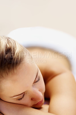 Buy stock photo Woman, sleeping and rest on bed in spa for health, wellness and recovery with closeup, peace or quiet. Girl, space and tired at resort for rehabilitation, massage or physical therapy for body fatigue