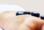 Therapy - Arrangement of hot stones placed on a woman's back