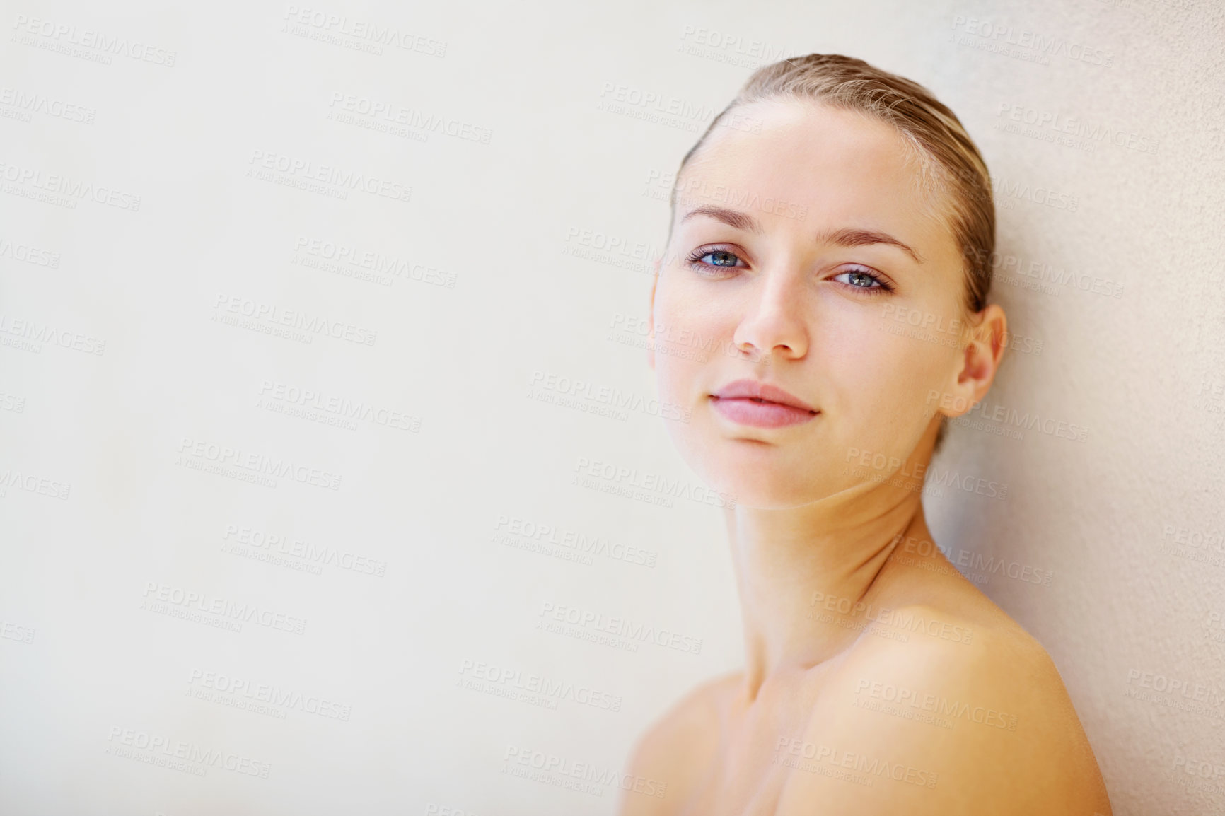 Buy stock photo Portrait, skincare and space with a young woman on a wall background for wellness or natural treatment. Face, beauty and mock up with a person at the spa or salon for dermatology or self care