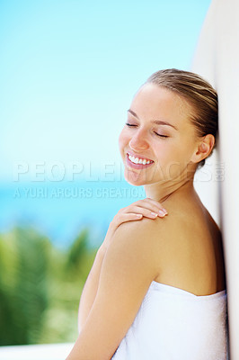 Buy stock photo Woman, wall and nature with skincare, health and hands with smile for results by blue sky background. Girl, touch skin and change with cosmetics, wellness and transformation with mockup space outdoor