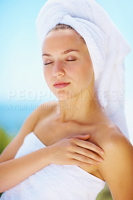 Buy stock photo Sleep, woman and spa towel outdoor with wellness, skincare and health treatment with blue sky. Tropical vacation, rest and zen of a calm female person on vacation with body care and ready for massage