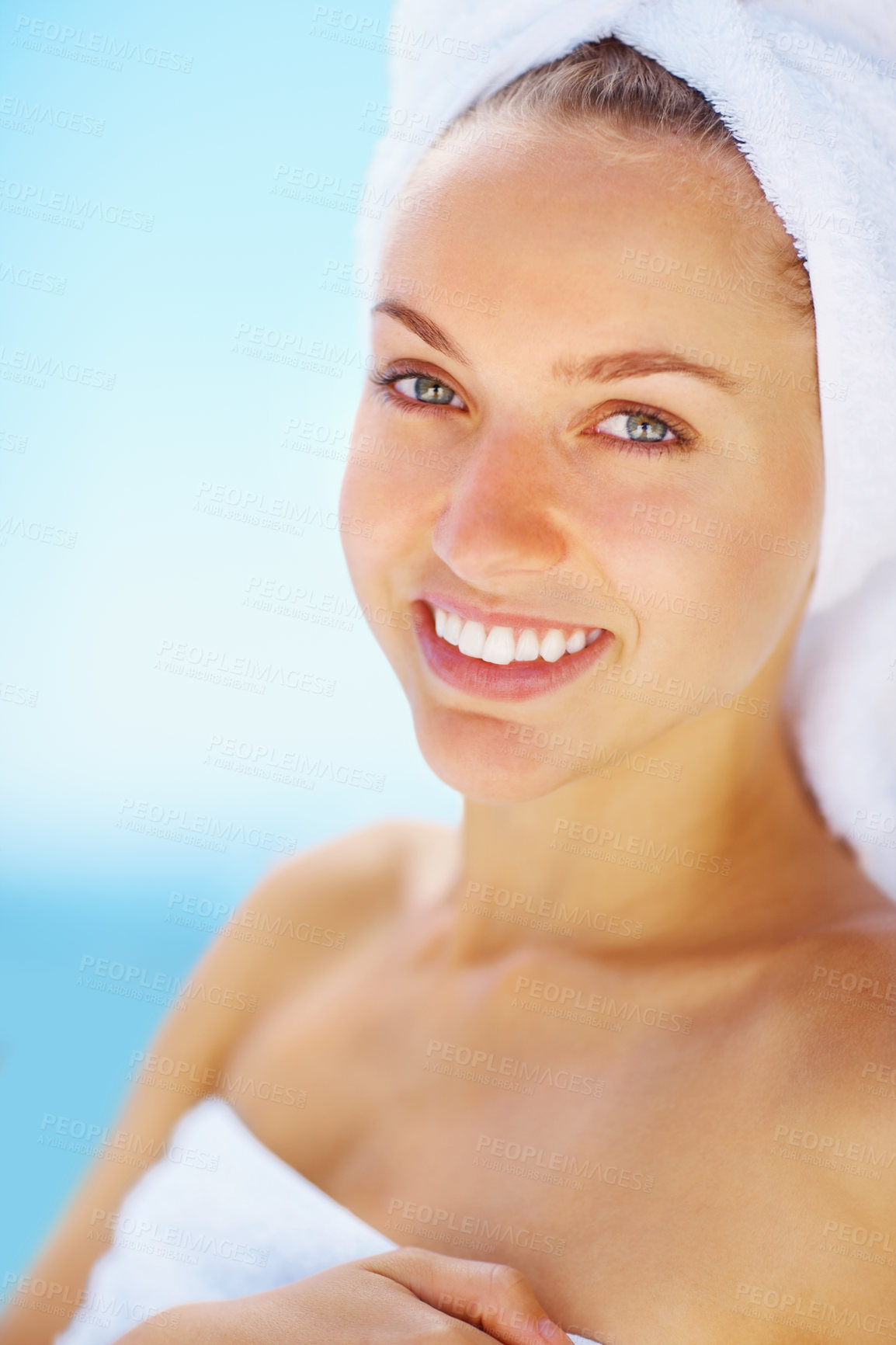 Buy stock photo Portrait, happy woman and spa towel outdoor with wellness, skincare and health treatment with blue sky. Smile, rest and zen of a calm female person on vacation with body care and ready for massage