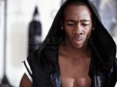 Buy stock photo Muscular African American male boxer wearing hooded robe