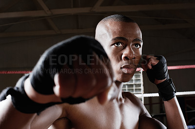 Buy stock photo Muscular African American male boxer in action