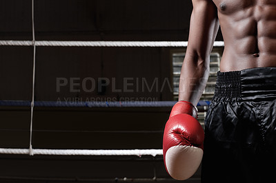 Buy stock photo Muscular man standing in ring wearing boxing gloves