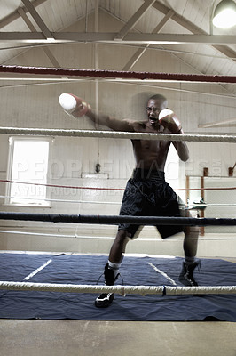 Buy stock photo Full length of African American male boxer in action