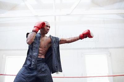 Buy stock photo Muscular African American man practicing in ring