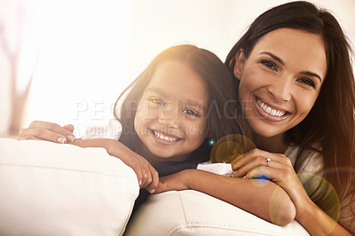 Buy stock photo Cropped portrait of a happy mother and daughter at home