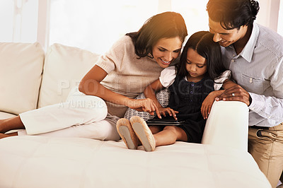 Buy stock photo Happy parents, child and tablet on sofa for entertainment, movie or bonding together at home. Mother, father and daughter on technology in relax for online streaming, series or reading ebook at house