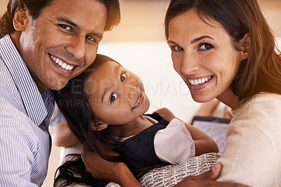 Buy stock photo Happy, sofa and portrait of parents and child for bonding, relationship and relax in morning. Family, home and mother, father and young girl in living room for fun, childhood and weekend together
