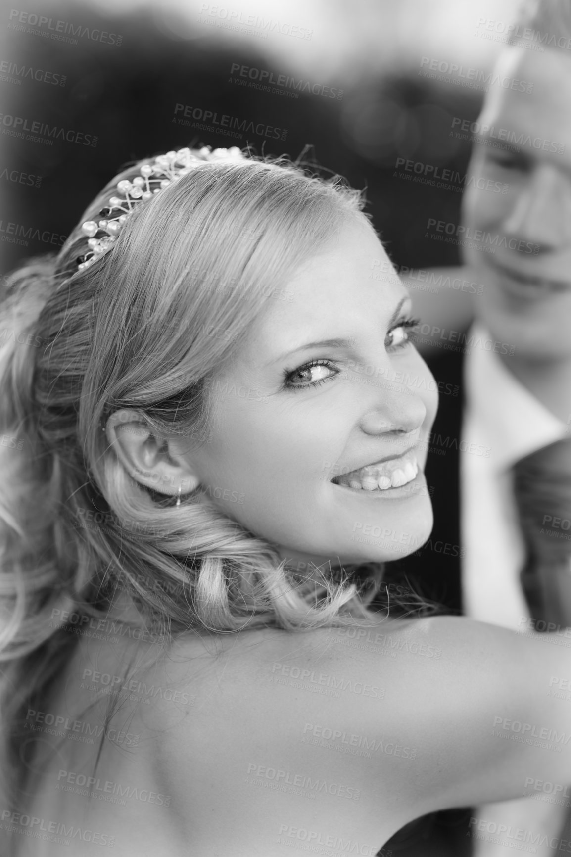 Buy stock photo Shot of a bride and groom on their wedding day in grayscale