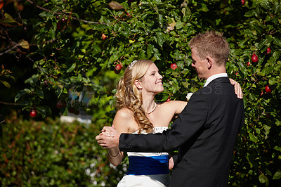 Buy stock photo Shot of a bride and groom dancing on their wedding day