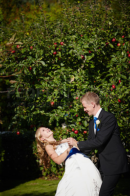 Buy stock photo Shot of a bride and groom dancing on their wedding day