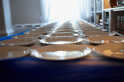 Buy stock photo Shot of plates arranged on a table at a wedding reception