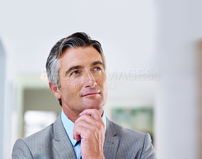 Buy stock photo Shot of a mature businessman deep in thought