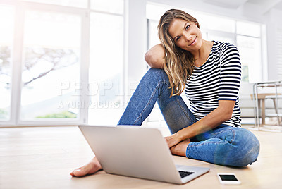 Buy stock photo Portrait of a young woman sitting on the floor with her cellphone and laptop