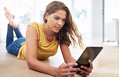 Buy stock photo Home, scroll and woman on floor with tablet, streaming subscription, watching movies and films. Apartment, female person and digital for website, networking and chatting on social media in house