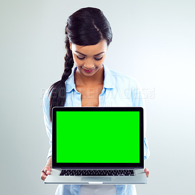 Buy stock photo Woman, laptop and green screen in studio with mockup space for business website, promotion or white background. Female person, digital and about us with online shopping, notification or information
