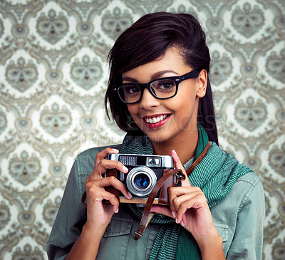 Buy stock photo Glasses, photography and portrait of woman with camera and funky, trendy and cool fashion for job. Smile, photographer and female person with casual outfit and vintage dslr equipment by wallpaper