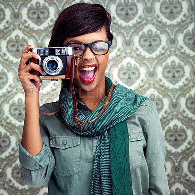 Buy stock photo Happy, photography and portrait of woman with camera and funky, trendy and cool fashion for job. Smile, photographer and female person with casual outfit and vintage dslr equipment by wallpaper.