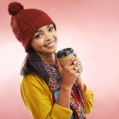 Buy stock photo Winter fashion, woman and smile in portrait with coffee, warmth and comfort on pink background. Female person, happy and cozy in studio for cold season, wellbeing and casual wear for outgoing