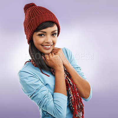 Buy stock photo Portrait, smile and woman in winter fashion isolated on purple studio background. Face, happy and young model in warm scarf, clothes and student with stylish beanie for cold weather in Argentina