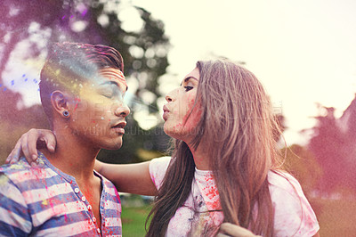 Buy stock photo Happy, powder paint and couple of friends with Holi festival and colorful event with blowing. Celebration, love and excited in nature with hipster people and crazy color dust for party together