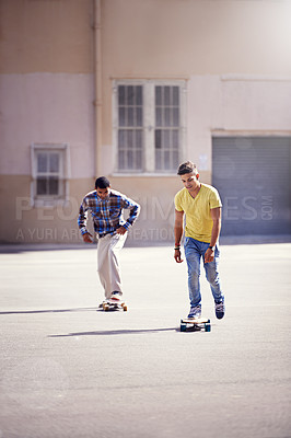 Buy stock photo Skateboard, friends and men in city for exercise, training and competition for fun hobby in town. Skate park, fashion and young people in trendy, casual and street style for sports and fitness