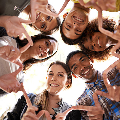 Buy stock photo Finger star, circle and portrait of friends with diversity, unity and collaboration with a low angle. Teamwork, smile and group of multiracial people in huddle together for solidarity and community.